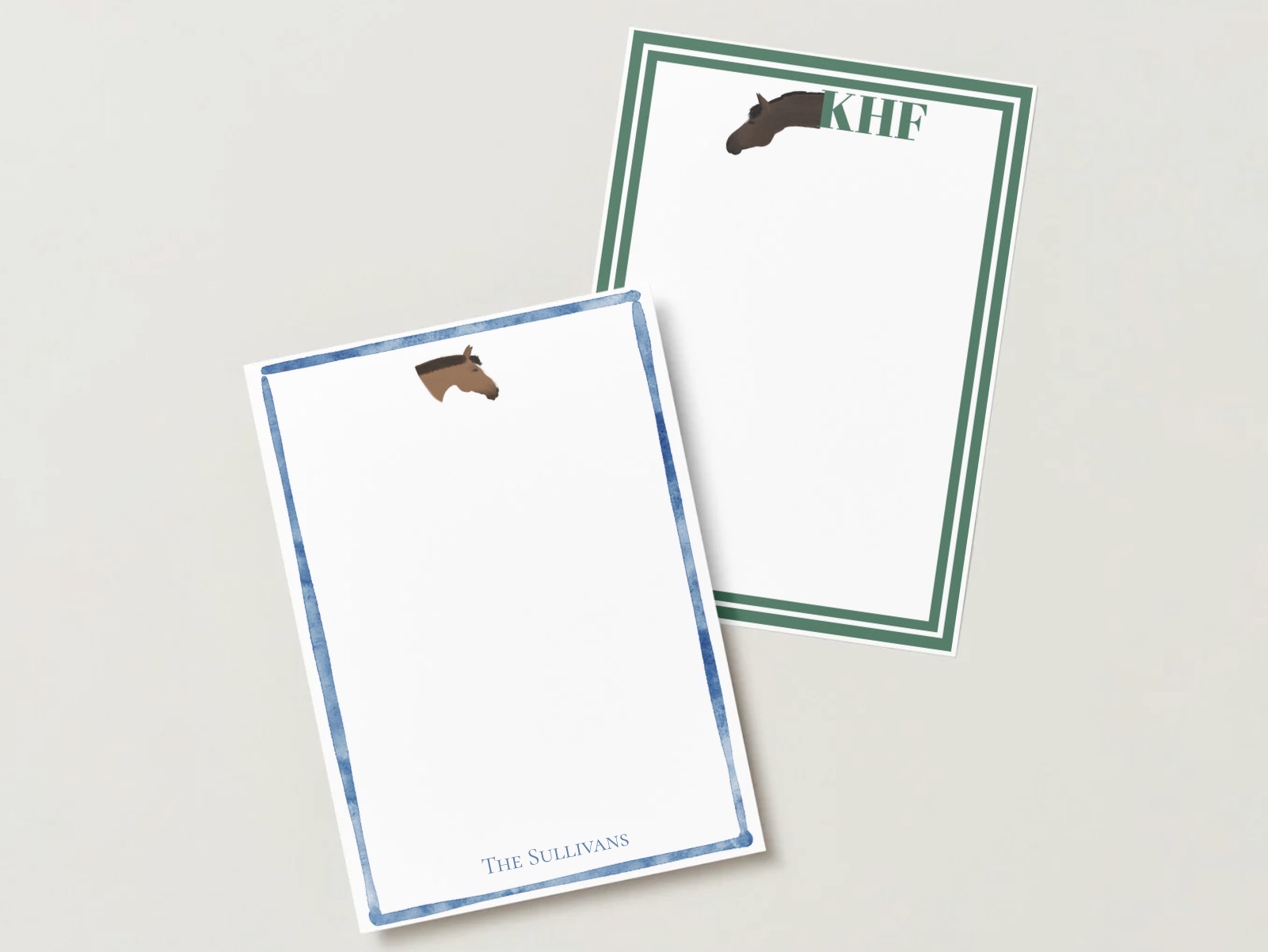 Two custom horse stationery cards, one with a blue watercolor border and one with a green monogram border